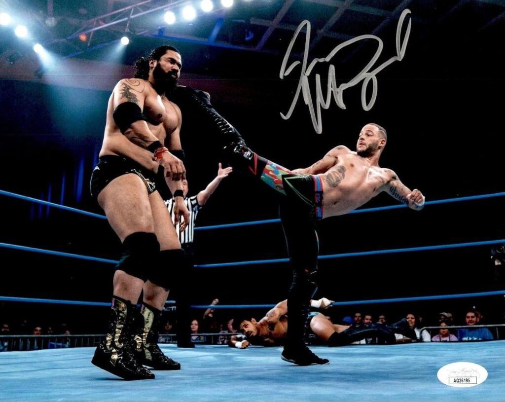 Trey Miguel Signed Impact In Ring Action 8×10 Photo #1 JSA COA – Autographed Soccer Photos