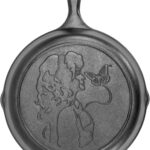 Lodge 10.25 Inch Dolly Parton Pre-Seasoned Cast Iron Stamped Skillet – Signature Teardrop Handle – Use in the Oven, on the Stove, on the Grill, or Over a Campfire, Black