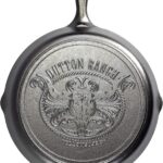 Lodge Pre-Seasoned Yellowstone Stamped Cast Iron Cookware – Signature Teardrop Handle – Use in the Oven, on the Stove, on the Grill, or Over a Campfire – 12 Inch Logo Skillet