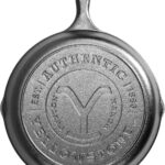 Lodge Pre-Seasoned Yellowstone Stamped Cast Iron Cookware – Signature Teardrop Handle – Use in the Oven, on the Stove, on the Grill, or Over a Campfire – 10.25 Inch Logo Skillet